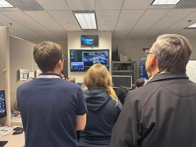 Members from NASA and Italian Space Agency watching the Blue Ghost lunar lander touch down on the Moon. Image credit: NASA